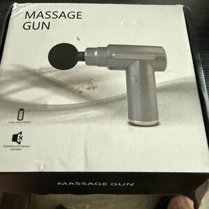 Black Massage Gun with 4 heads.  New in box
